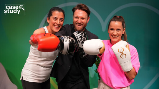 three people with boxing gloves